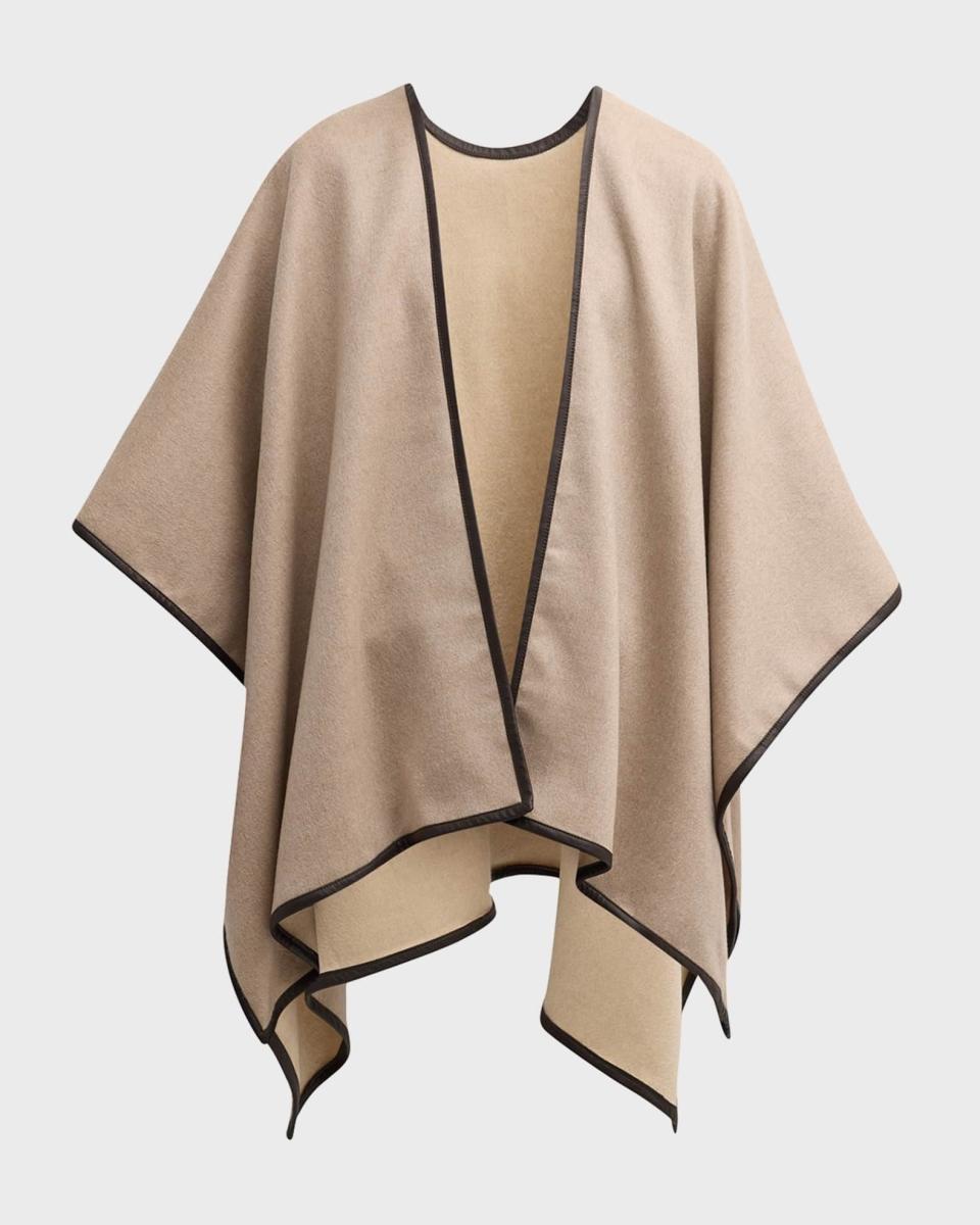 <p><a href="https://go.redirectingat.com?id=74968X1596630&url=https%3A%2F%2Fwww.neimanmarcus.com%2Fp%2Fsofia-cashmere-angular-reversible-cashmere-cape-prod266260256&sref=https%3A%2F%2F" rel="nofollow noopener" target="_blank" data-ylk="slk:Shop Now;elm:context_link;itc:0;sec:content-canvas" class="link ">Shop Now</a></p><p>Reversible Cashmere Cape</p><p>neimanmarcus.com</p><p>$696.00</p>