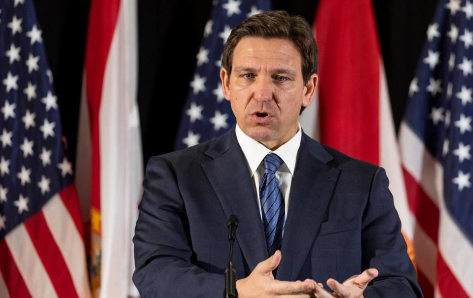 Florida Governor Ron DeSantis answers questions from the media during a press conference at Christopher Columbus High School on Monday, March 27, 2023, in Miami, Fla. The press conference was held to announce DeSantis’s signing of a private school voucher expansion, HB1, which allows more Florida school children become eligible for taxpayer-funded school vouchers.