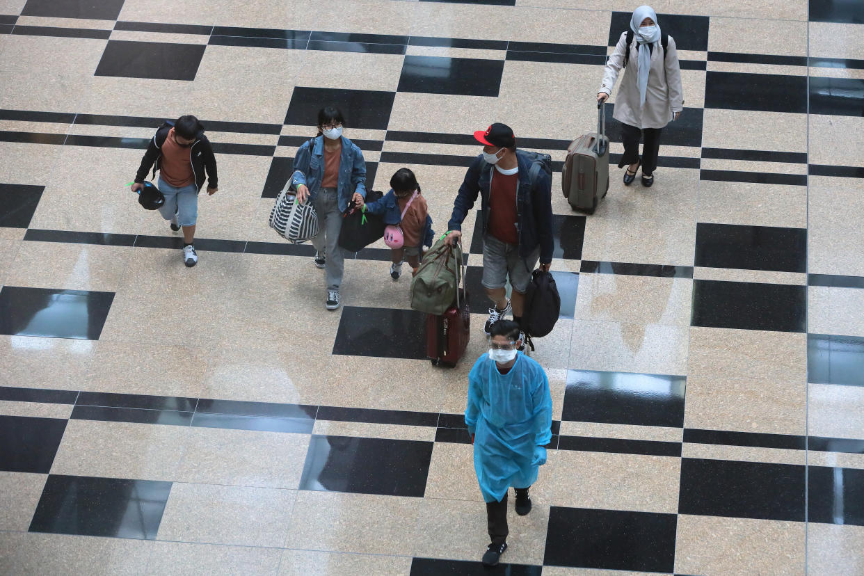 Travellers in the transit hall at Changi International Airport on September 8, 2021 in Singapore.  (Photo by Suhaimi Abdullah/NurPhoto via Getty Images)