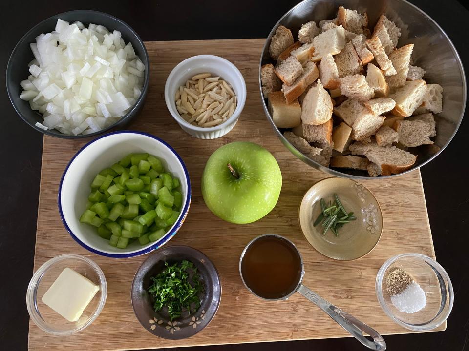 ingredients for Ina Garten's stuffing laid out on wooden cutting board