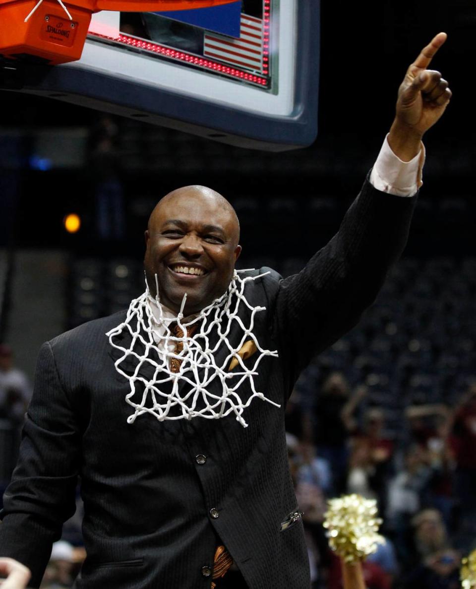Florida State coach Leonard Hamilton celebrates after cutting down the net after the Seminoles’ 85-82 victory over North Carolina in the ACC tournament final.