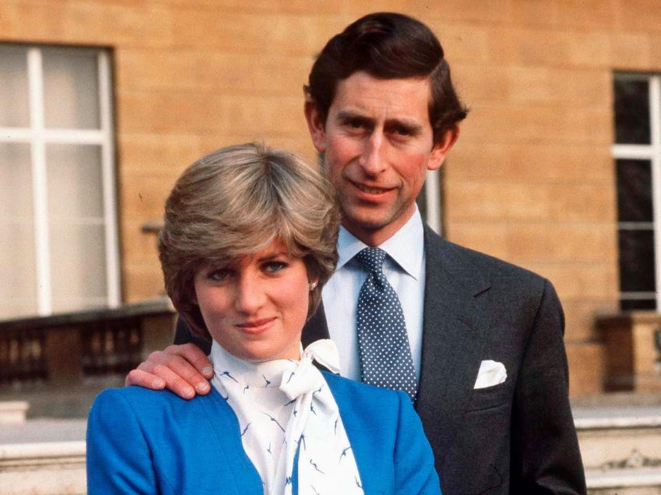 Charles and Princess Diana pose in the grounds of Buckingham Palace following the announcement of their engagement in 1981.