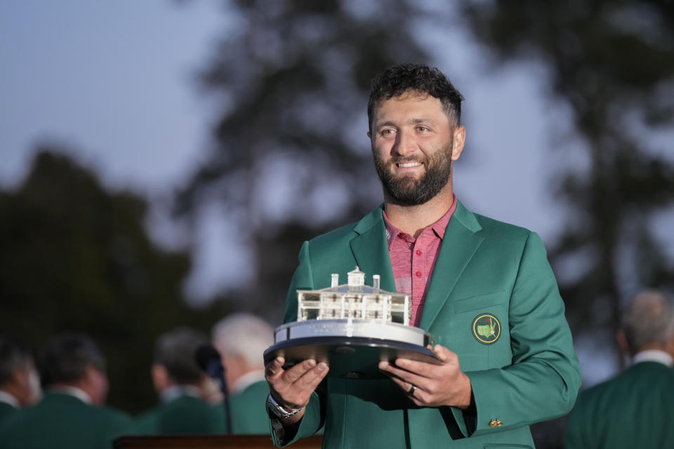 Jon Rahm, of Spain, holds up the trophy after winning the Masters golf tournament at Augusta National Golf Club on Sunday, April 9, 2023, in Augusta, Ga. (AP Photo/David J. Phillip)