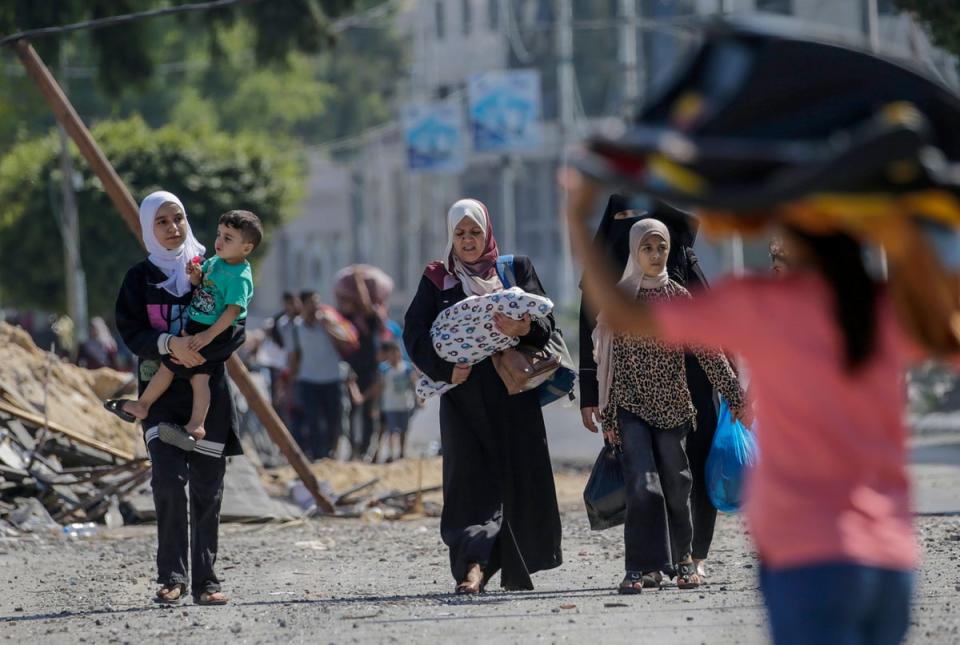 Women and children are seen evacuating Gaza City following an Israeli warning of increased military operations (EPA)