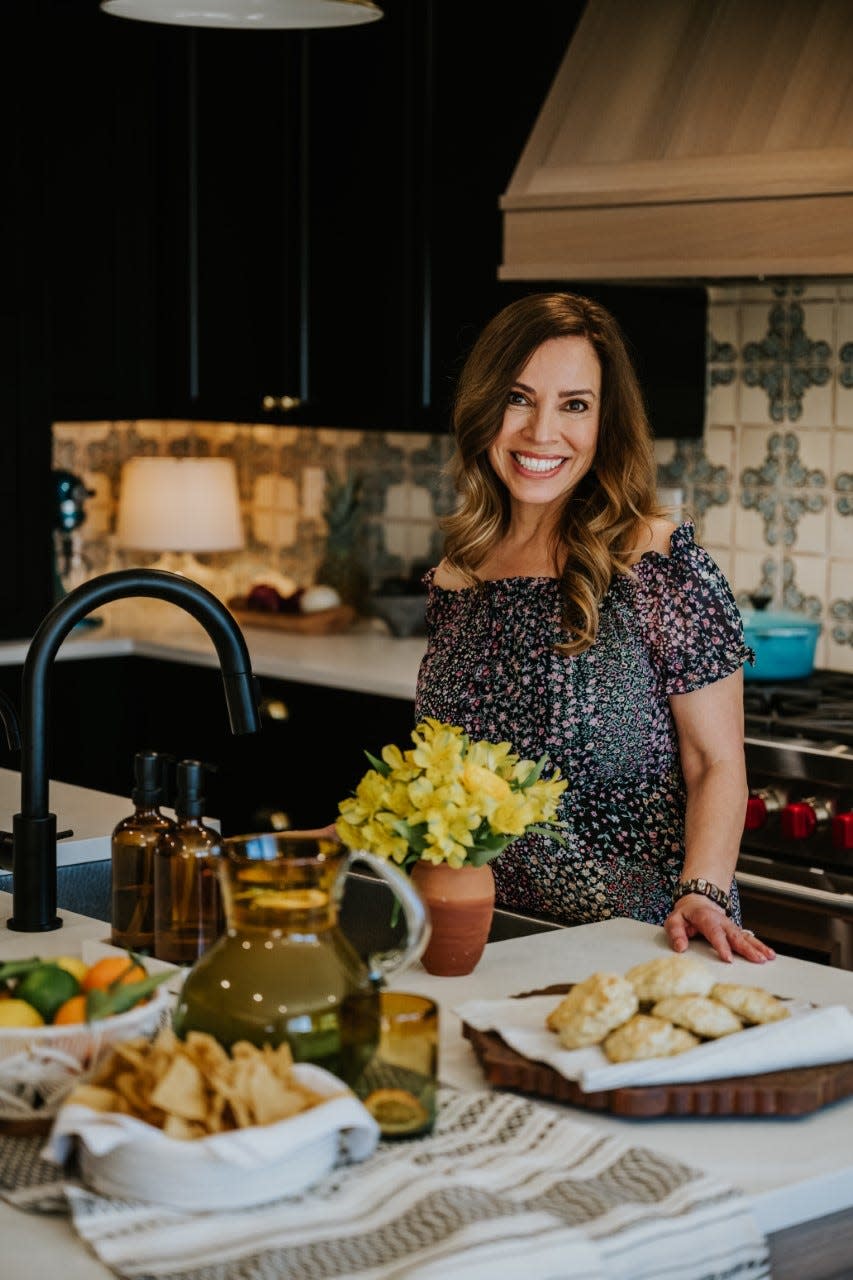 Food blogger and cookbook author Yvette Marquez-Sharpnack is shown in a kitchen. She is returning to El Paso to sign copies of her new book.