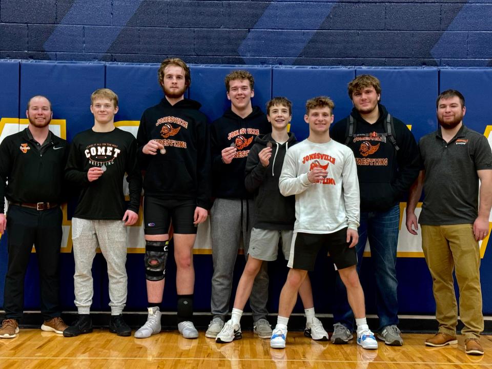 Jonesville celebrates a successful night at the Cascades Championship. Medalists (from left to right) include Cason Playford (2nd), Isaac Shively (3rd), Evan McColley (2nd), Harrison Packer (3rd), Tyler Milks (2nd) and Cooper Stevens (4th).