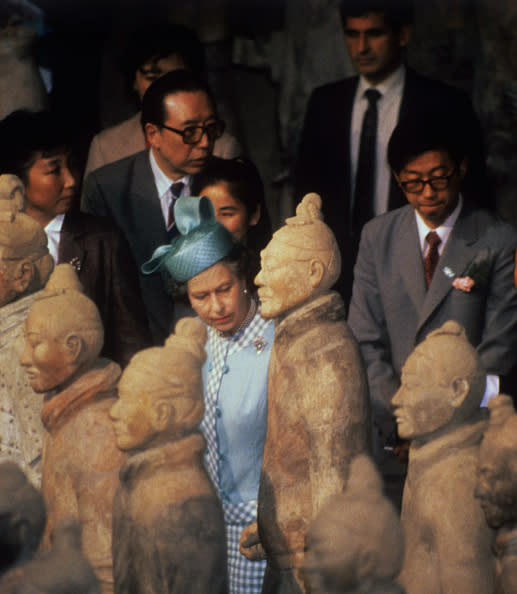 Queen Elizabeth II 'reviews' the ancient army of Terracotta Warriors which keeps symbolic guard over the tomb of the first Qin emperor.   (Photo by Ron Bell/PA Images via Getty Images)