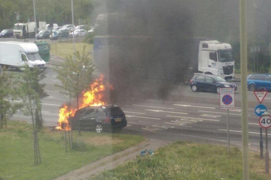 A busy section of the North Circular was closed after a car burst into flames: @999London