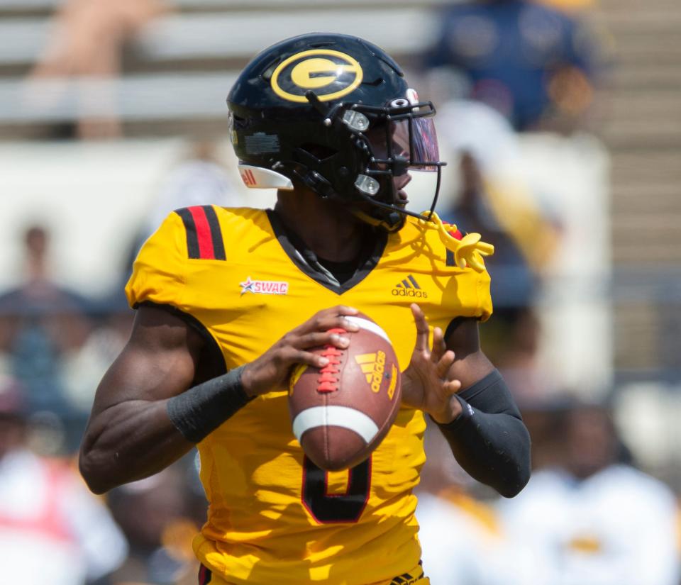 Grambling State quarterback Quaterius Hawkins (8) looks for an opening against Jackson State during the first half of an NCAA college football game in Jackson, Miss., Saturday, Sept. 17, 2022. (Barbara Gauntt/The Clarion-Ledger via AP)