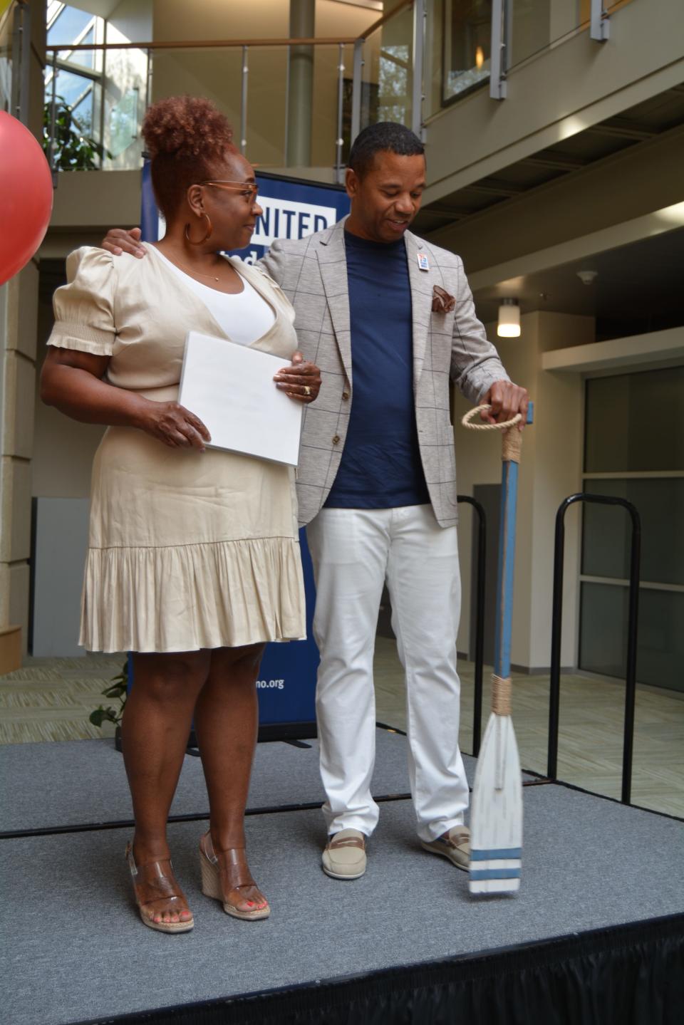 Adonica and Demarko Coleman, co-chairs of the Heart of Missouri United Way campaign committee, ask people to join them in the boat and paddle together in supporting the United Way and its goal of raising $3.1 million. 