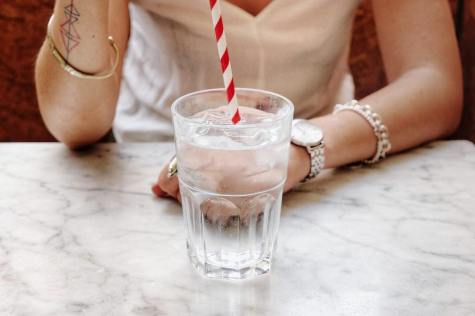 drinking water with paper straw