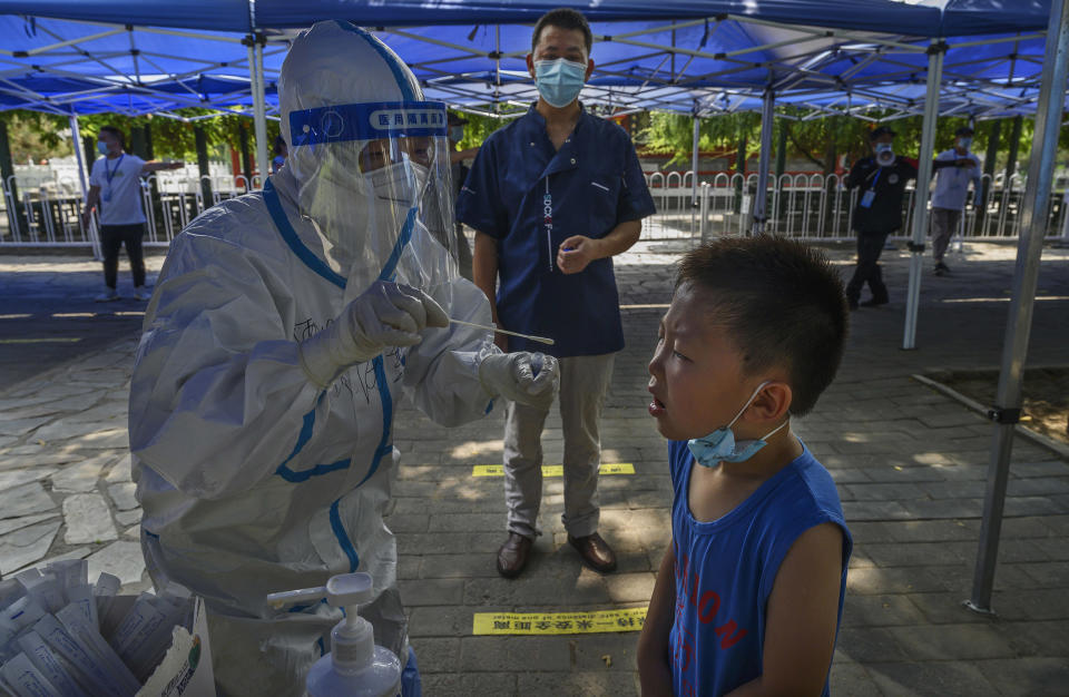 Image: COVID-19 testing in China (Kevin Frayer / Getty Images)