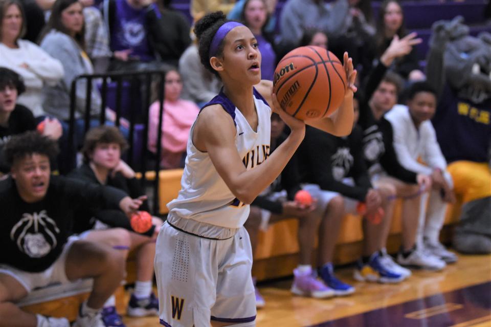 Wylie's Mycala Reed (11) shoots, and makes, the game-winning 3-pointer during Friday's game against Lubbock Coronado at Bulldog Gym Reed finished with 12 points in the 51-48 win.