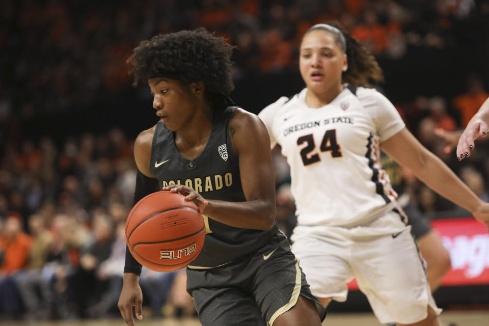 Colorado's Jaylyn Sherrod (1) turns back to the middle, away from Oregon State's Destiny Slocum (24) during the first half of an NCAA college basketball game in Corvallis, Ore., Sunday, Jan. 5, 2020. (AP Photo/Amanda Loman)