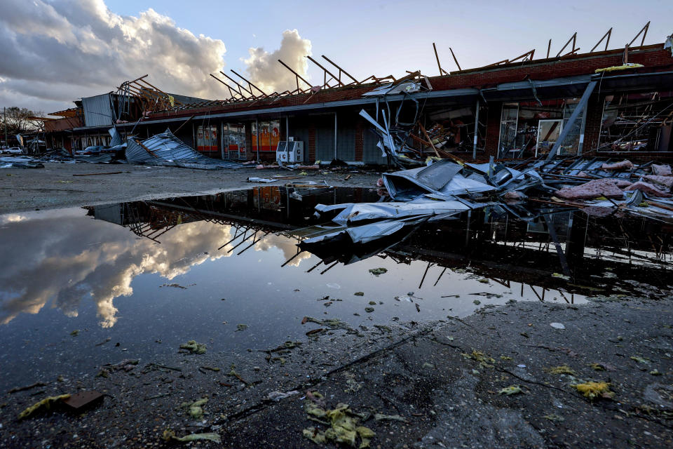 The roof of a local businesses is strewn about after a tornado passed through Selma, Ala., Thursday, Jan. 12, 2023. (AP Photo/Butch Dill)