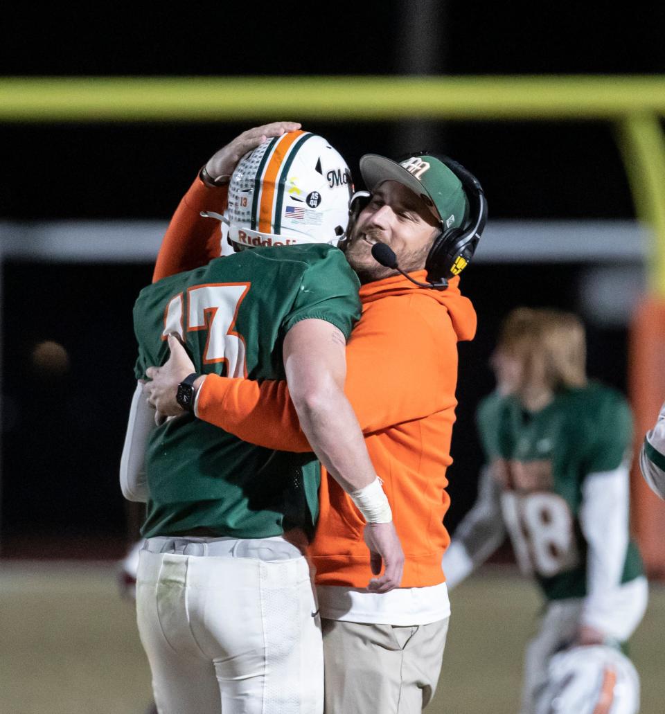 Mosley and Lincoln battled in the Region 1-6A semifinals at Tommy Oliver Stadium Friday, November 19, 2021. The Dolphins came away with the win 31-28. Mosley coach Tommy Joe Whiddon hugs quarterback Colt Horton after time expired on the train.