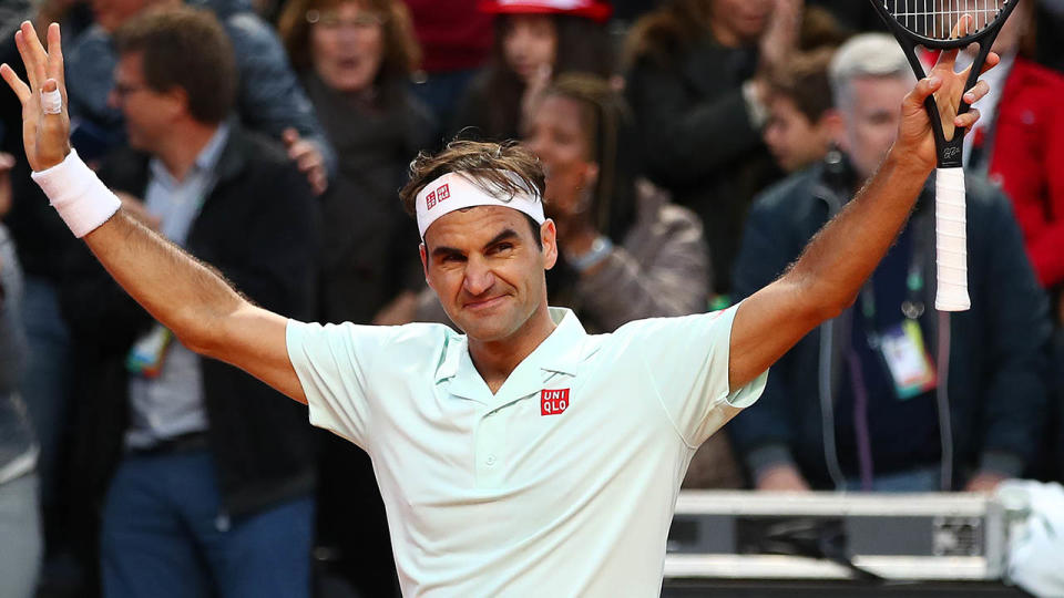 Roger Federer celebrates. (Photo by Clive Brunskill/Getty Images)