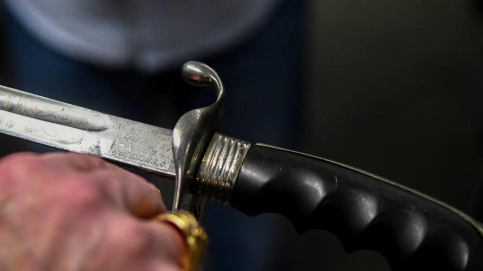 John Warley, a Beaufort Art Museum board member, shows the details of a saber forged in Columbus, Ohio that will go to auction in the March 14 “Piece of Our Past Fundraising Auction” to be held in Beaufort.