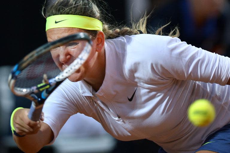 Victoria Azarenka of Belarus returns the ball to Maria Sharapova of Russia during their WTA Rome Open tennis tournament match at the Foro Italico in Rome on May 15, 2015