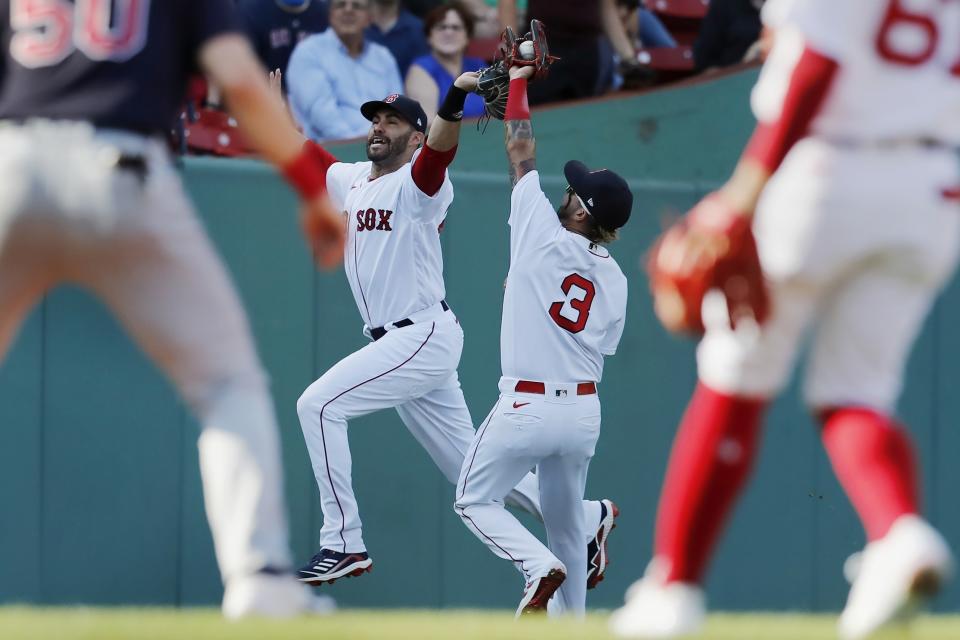 Boston Red Sox's Jonathan Arauz (3) makes the catch beside J.D. Martinez on a popout by Cleveland Indians' Andres Gimenez during the third inning of a baseball game, Saturday, Sept. 4, 2021, in Boston. (AP Photo/Michael Dwyer)