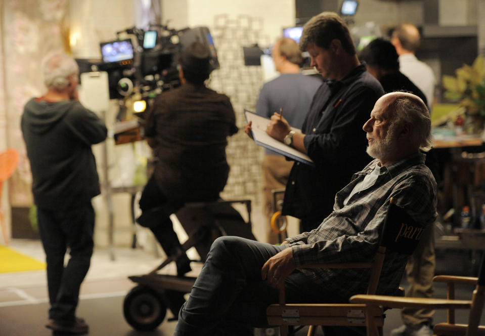 James Burrows, director of the television series "Partners," watches over the show's crew on Wednesday, Sept. 19, 2012, at Warner Bros. Studios in Burbank, Calif. Burrows isn't a household name. But behind the scenes Burrows reigns as a comedy giant. He's a director whose brand of funny business has helped shape TV comedy season after season. (Photo by Chris Pizzello/Invision/AP)