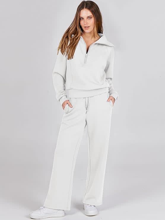 Model wears a matching white tracksuit