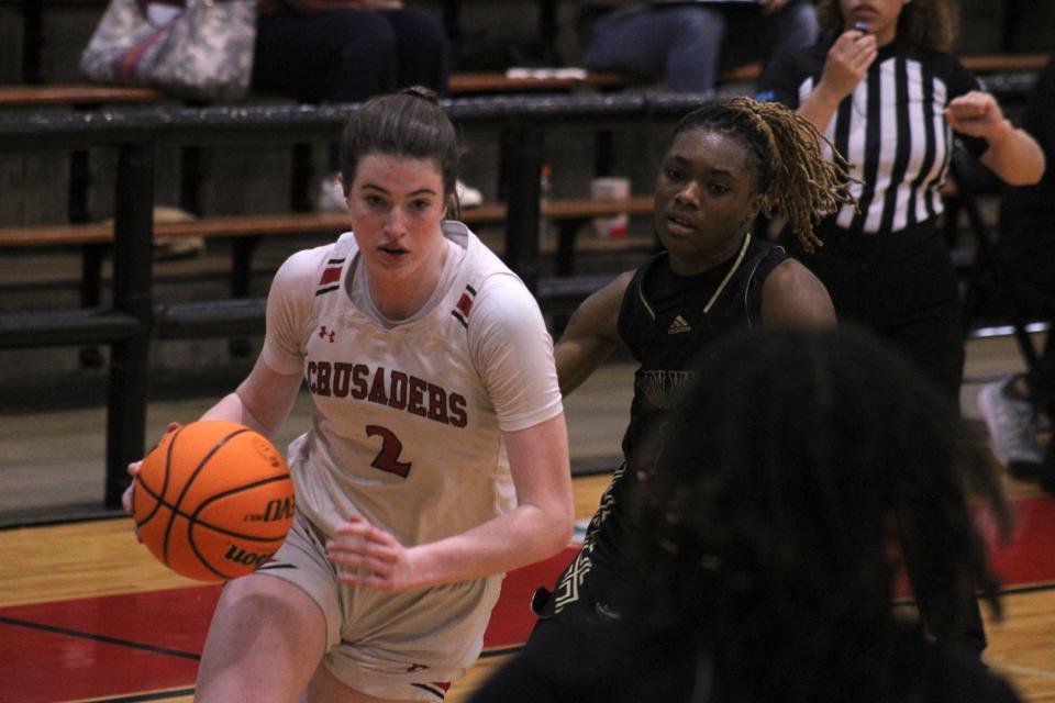 Bishop Kenny forward Clare Coyle (2) drives against the Oakleaf defense during a high school girls basketball game on January 19, 2023. [Clayton Freeman/Florida Times-Union]