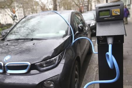 An electric car is plugged into a charging point in London, Britain April 7, 2016. REUTERS/Neil Hall/Files