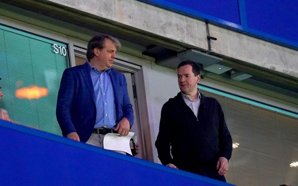 Chelsea owner Todd Boehly (left) and George Osborne in the stands ahead of the Premier League match at Stamford Bridge - John Walton/PA