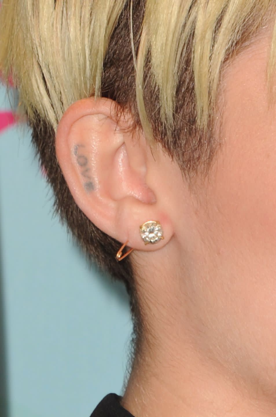 <p>Miley got the word "love" tattooed on her ear back in 2010, to "block out all the crap that everyone throws into your ears." She explained to <em><a href="https://www.nbcchicago.com/entertainment/celebrity/Miley_Cyrus_On_Her_New_Tattoo___Everyone_s_A_Little_Behind_The_Times____-_ARTICLE-96717724.html" rel="nofollow noopener" target="_blank" data-ylk="slk:Access Hollywood;elm:context_link;itc:0;sec:content-canvas" class="link ">Access Hollywood</a></em>, "[You're only supposed to hear the things coming from the people that genuinely love you." </p>