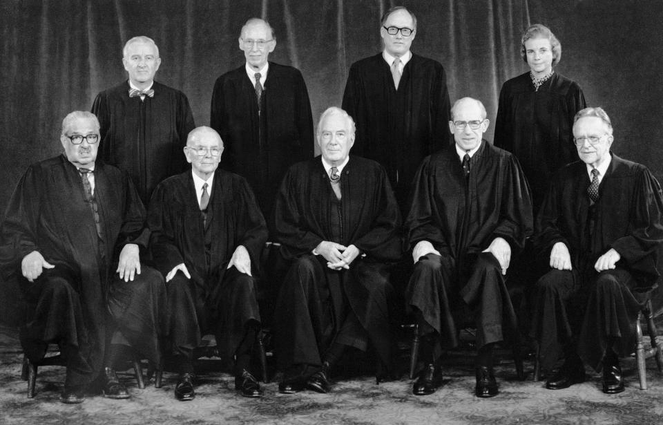 FILE - With the addition of the Supreme Court's newest member, Associate Justice Sandra Day O' Connor, top row right, the high court sits for a new group photograph in 1982 in Washington. Seated from left are Associate Justice Thurgood Marshall; Associate Justice William Brennan Jr.; Chief Justice Warren Burger, Associate Justice Byron White and Associate Justice Harry Blackmun. Standing from left, Associate Justice John Paul Stevens, Associate Justice Lewis Powell, Associate Justice William Rehnquist and Associate Justice Sandra Day O' Connor. (AP Photo, File)