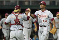 Florida State pitcher Jameis Winston, right, celebrates with catcher Danny de La Calle after the Seminoles swept Clemson in an NCAA college baseball doubleheader at Doug Kingsmore Stadium in Clemson, S.C. on Saturday, March 22, 2014. Florida State won the first game 11-1, and took the nightcap 4-3.(AP Photo/Anderson Independent-Mail, Mark Crammer) GREENVILLE OUT SENECA OUT