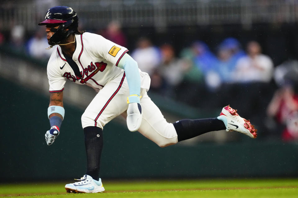 Atlanta Braves' Ronald Acuña Jr. steals second base in the foirst inning of a baseball game against the New York Mets Tuesday, April 9, 2024, in Atlanta. (AP Photo/John Bazemore)