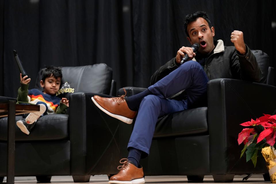 Republican presidential candidate businessman Vivek Ramaswamy speaks as his son Karthik, left, looks on during U.S. Rep. Randy Feenstra's, R-Iowa, Faith and Family with the Feenstras event, Saturday, Dec. 9, 2023, in Sioux Center, Iowa.
