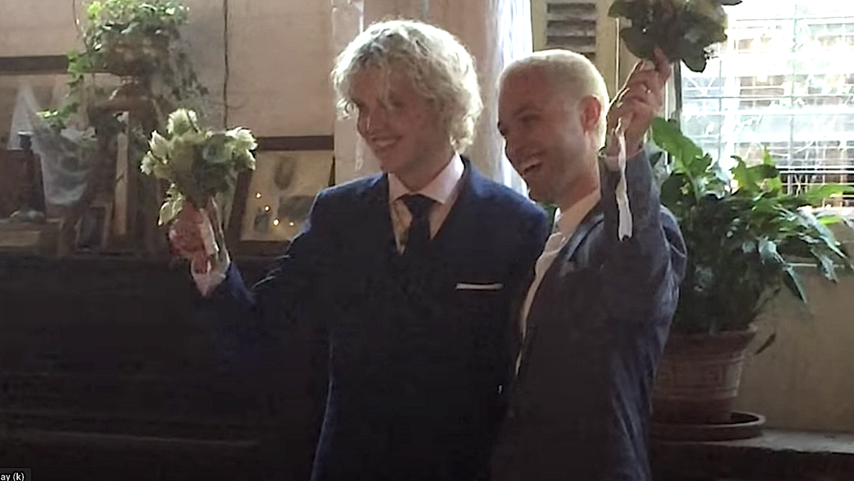 Cub Sport's Tim Nelson and Sam Netterfield on their wedding day in 2018. (Photo: YouTube)