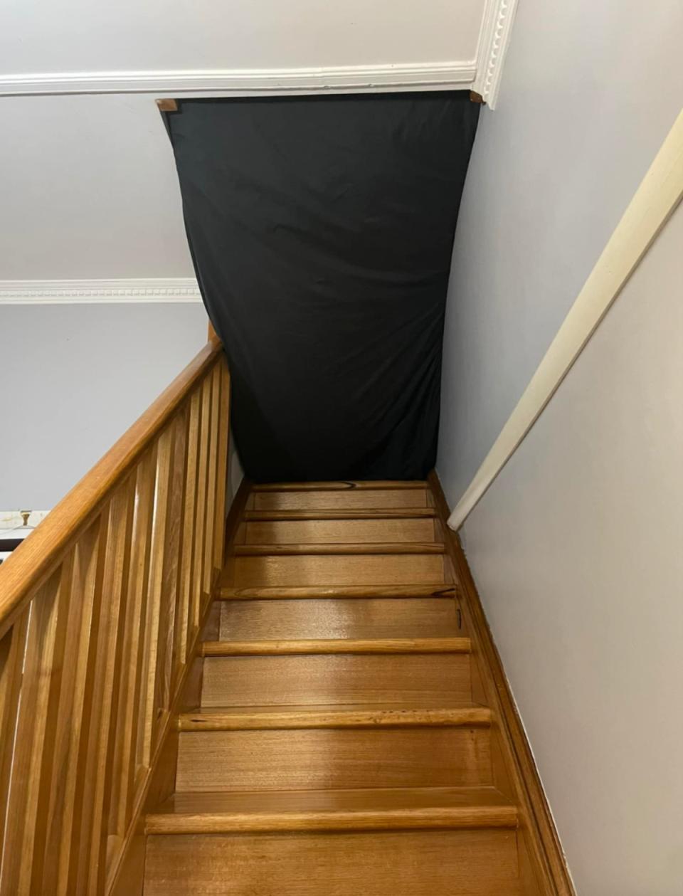 mattress wedged into stairwell. 