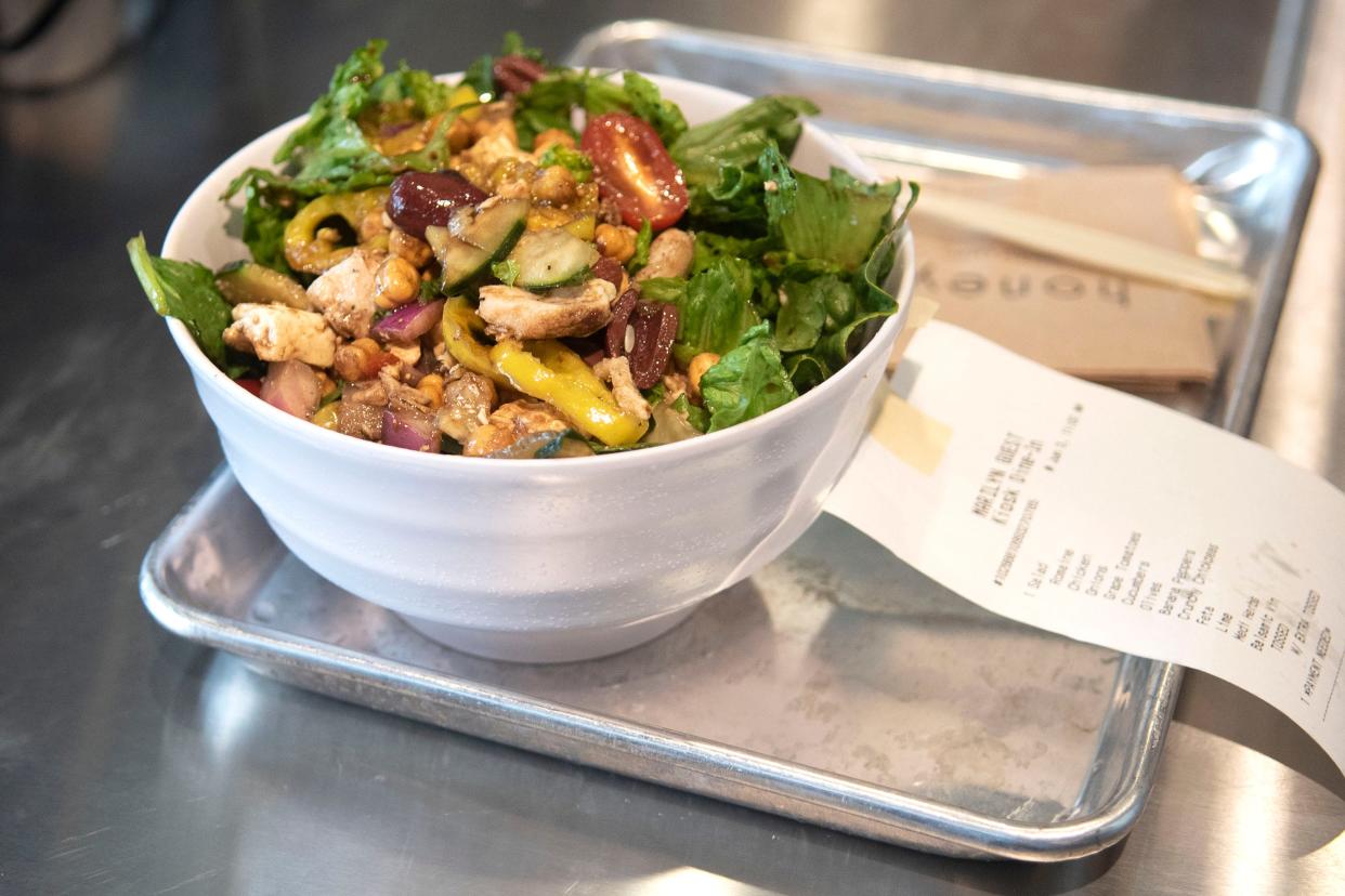 A bowl of create your own salad sits on the counter for pickup at Honeygrow's new location in Quakertown on Friday, June 3, 2022. This new location is the Philadelphia-based company's 27th since its first store in 2012.