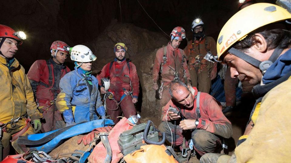 PHOTO: Rescuers gather around a radio in Morca Cave, as they take part in a rescue operation to reach U.S. caver Mark Dickey who fell ill and became trapped some 1,000 meters underground, near Anamur in Mersin province, southern Turkey, Sept. 7, 2023. (Agnes Berentes via Reuters)