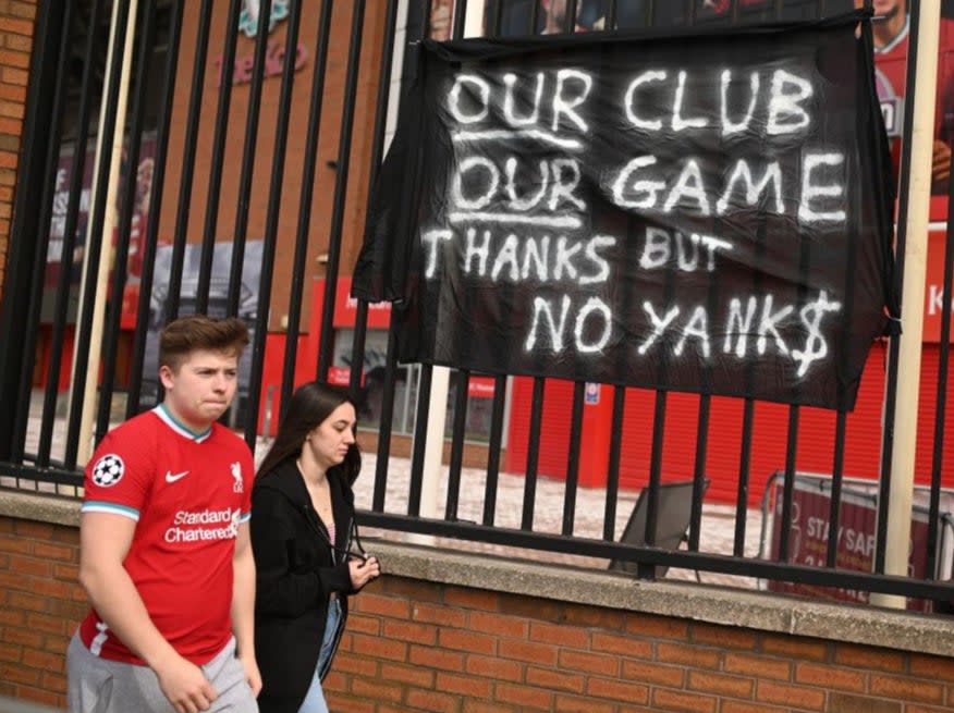 Supporters protest against Liverpool owner John W HenryAFP via Getty Images