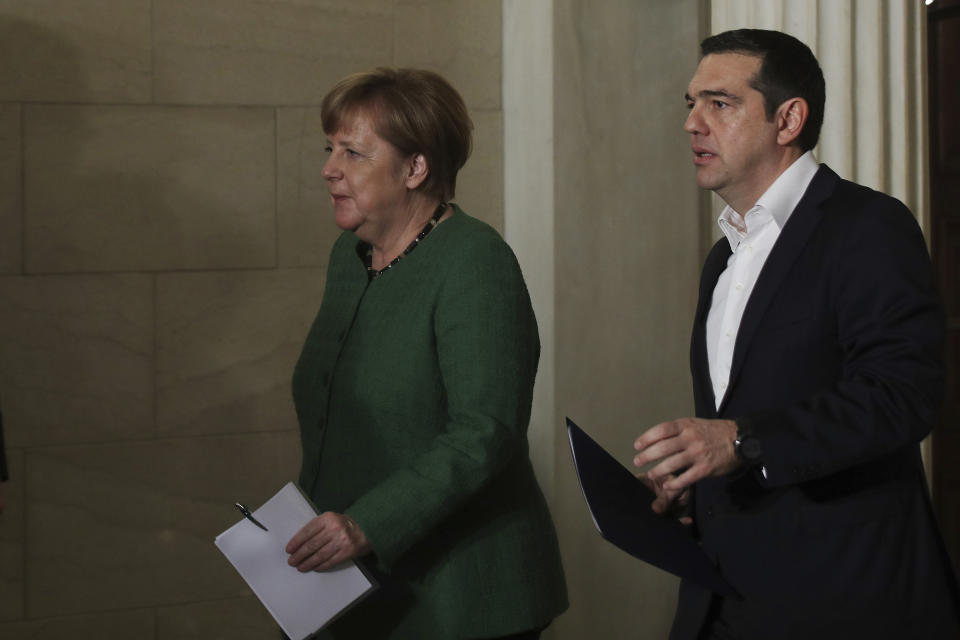 German Chancellor Angela Merkel, left, and Alexis Tsipras leave a press conference after their meeting in Athens, Thursday Jan. 10, 2019. Merkel is widely blamed in Greece for the austerity that the country has lived through for much of the past decade, which led to a sharp and prolonged recession and a consequent fall in living standards. (AP Photo/Petros Giannakouris)