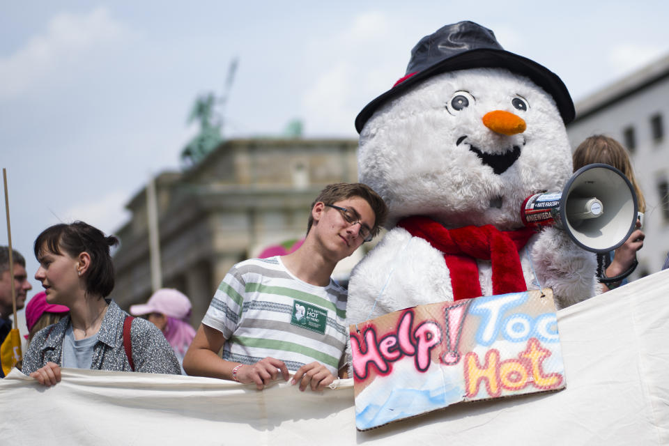 A protestor holds a poster as he attends a protest rally of the 'Friday For Future' movement in Berlin, Germany, Friday, May 24, 2019. Some thousands students attend the demonstration near the Brandenburg gate in the German capital. (AP Photo/Markus Schreiber)