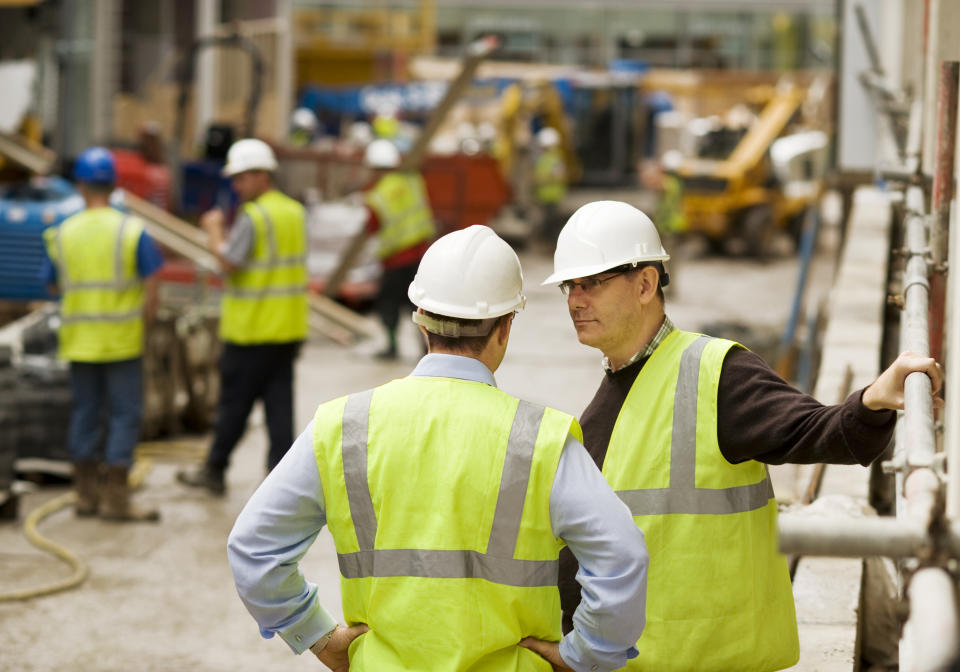 Architect and construction manager in discussion.