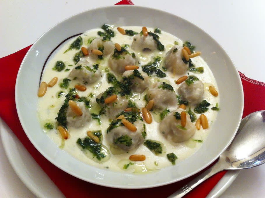 Shishbarak or shushbarak is a dumpling dish made in Iraq, Lebanon, Syria, Jordan and Palestine. After being stuffed with ground beef and spices, thin wheat dough parcels are cooked in yogurt and served hot in this sauce.
