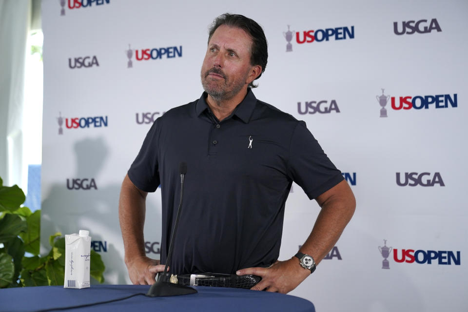 Phil Mickelson ponders a question at a press conference, Monday, June 13, 2022, at The Country Club in Brookline, Mass., ahead of the U.S. Open golf tournament. (AP Photo/Robert F. Bukaty)