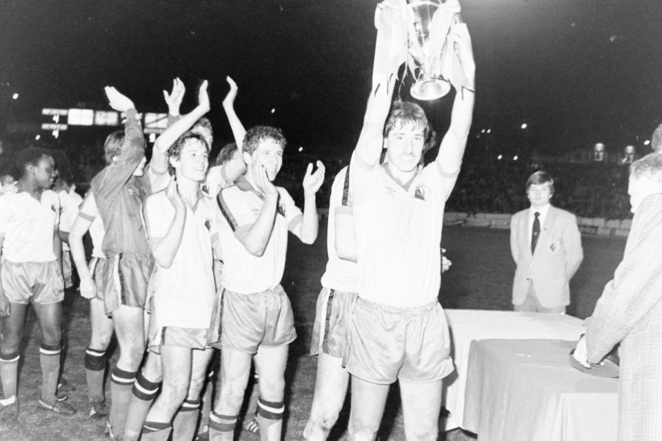 Watford Observer: Watford captain Colin Hull holds the trophy aloft