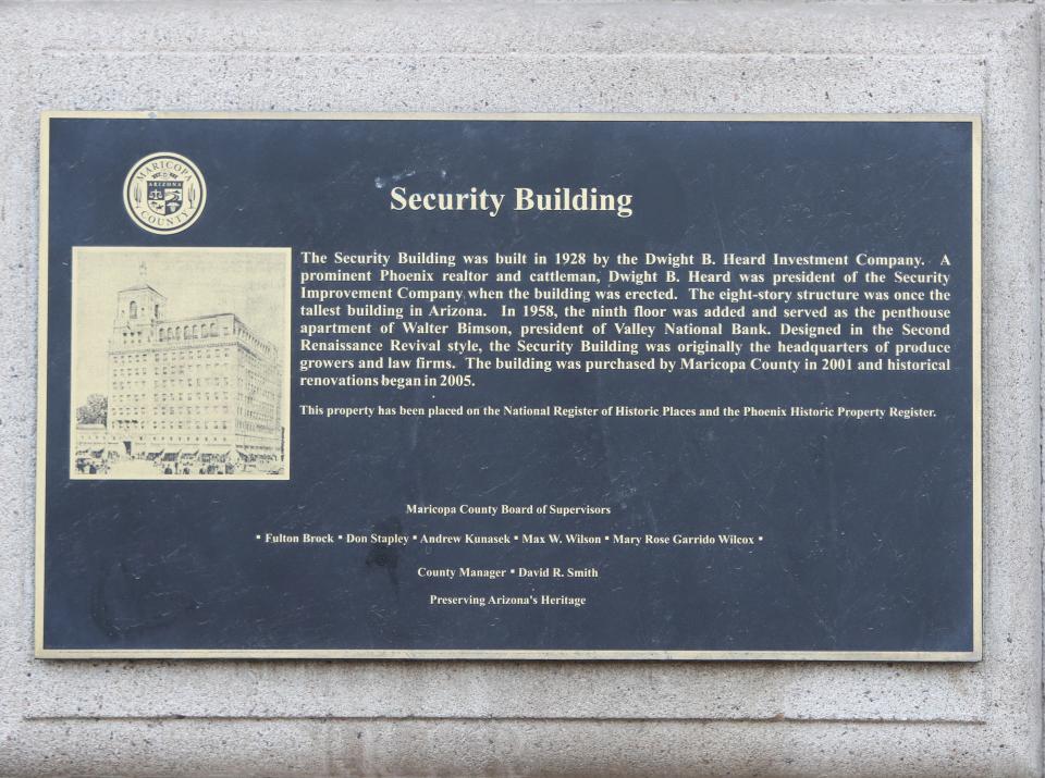A plaque describes the history of the Security Building, a historic building owned by Maricopa County, on Central Avenue in downtown Phoenix on Aug. 6, 2023.