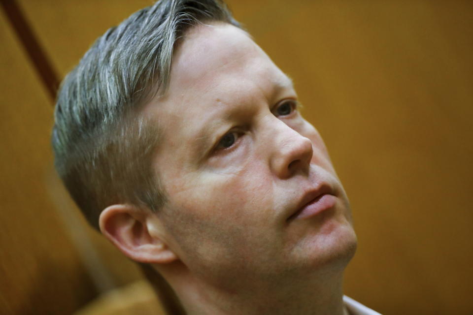 Main defendant Stephan Ernst looks on in the courtroom at the higher regional court in Frankfurt, Germany, Thursday, Jan. 28, 2021. The German court has convicted the 47-year-old far-right extremist Stephan Ernst of the murder of Walter Luebcke, a regional politician, in a brazen killing that shocked the country, and sentenced to life in prison. (Kai Pfaffenbach/Pool Photo via AP)