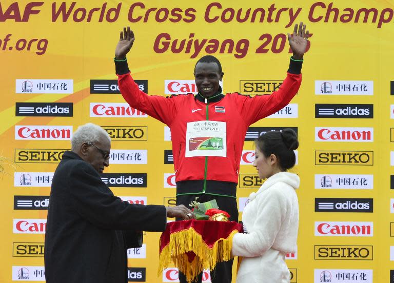 Geoffrey Kamworor celebrates his victory in the men's race in World Cross Country Championships in Guiyang