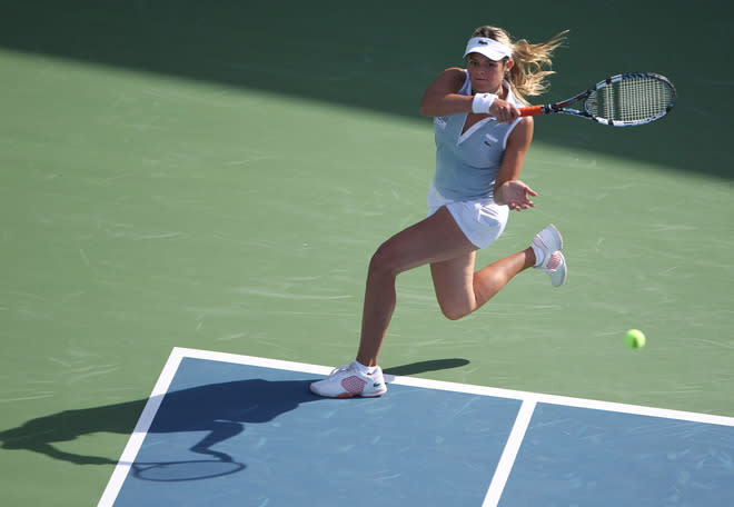 Aleksandra Wozniak of Canada returns the ball to Agnieszka Radwanska of Poland during their Dubai WTA Open tennis match in the Gulf emirate on February 21, 2012. (Photo by Karim Sahib/AFP/Getty Images)