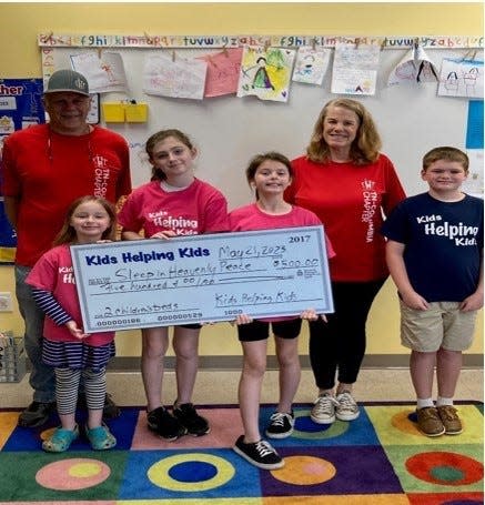 From left to right pictured are: Maggie Plucinik, Victoria Grisby, Aubree Hayes, and Levi Harlan. Bill and Beth Morrill, co-presidents of the local Sleep in Heavenly Peace chapter, are in the back.